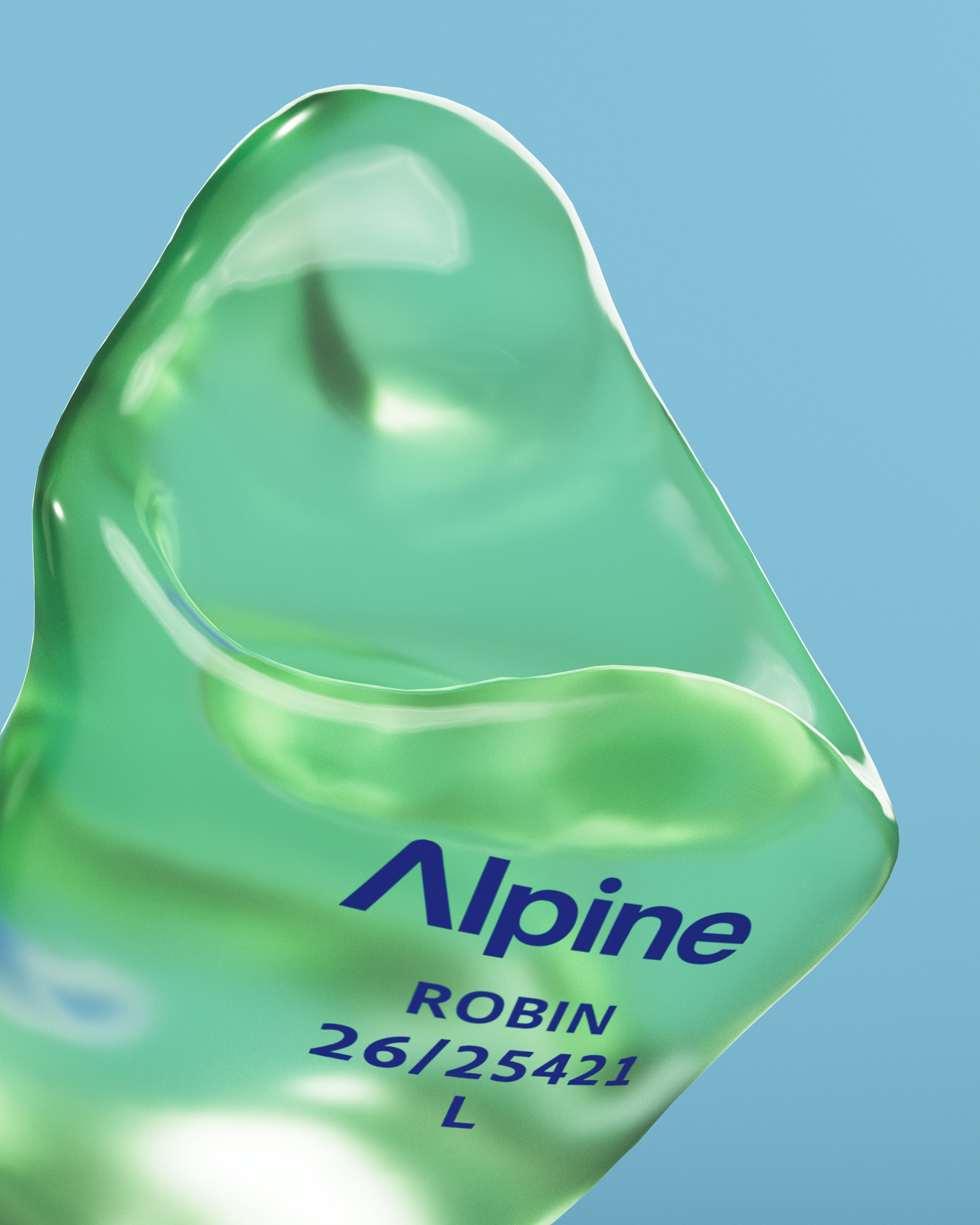 Close-up of an Alpine SleepSoft Custom Transparent Green earplug with the engraving &