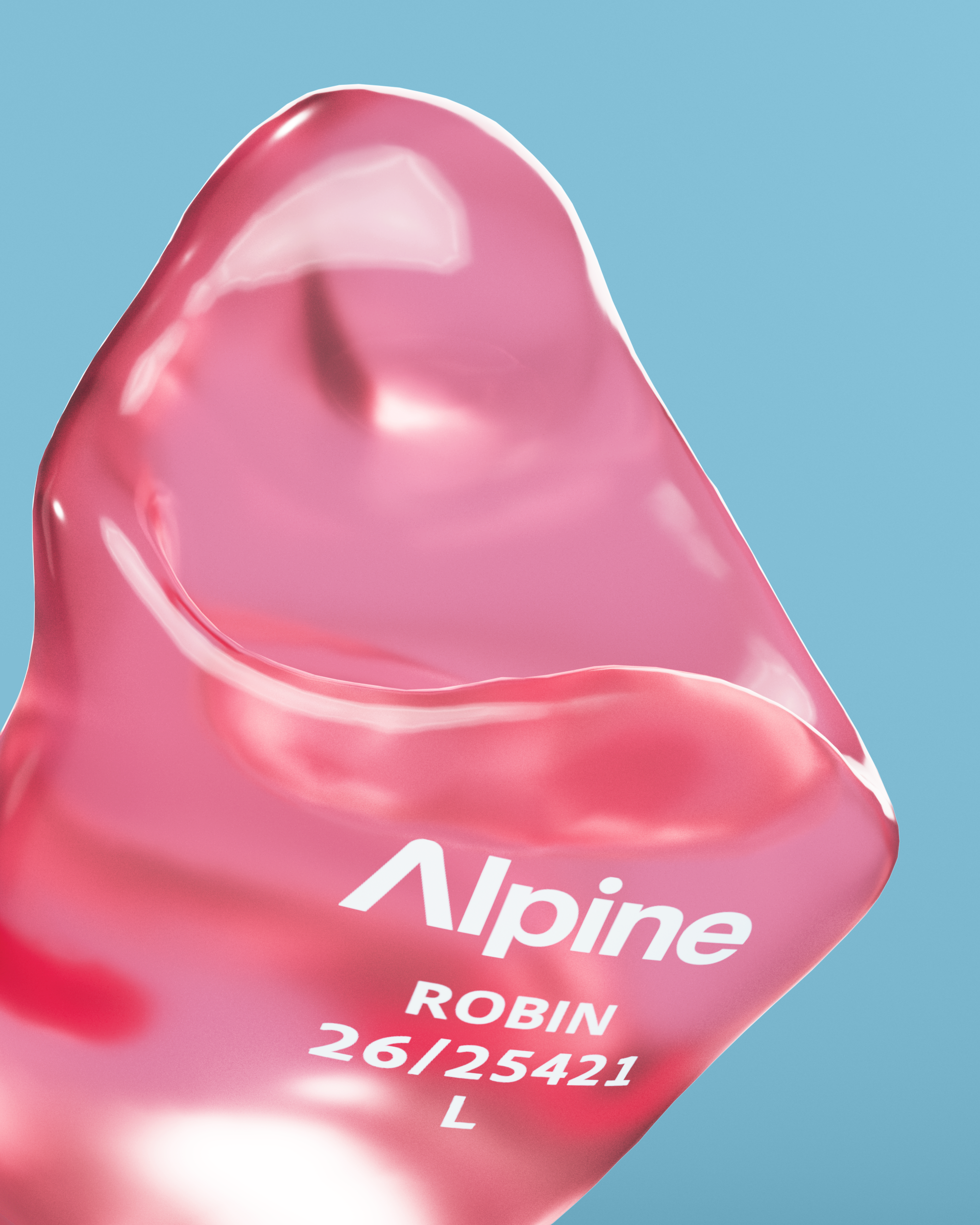 Close-up of an Alpine SleepSoft Custom Transparent Red earplug with the engraving &
