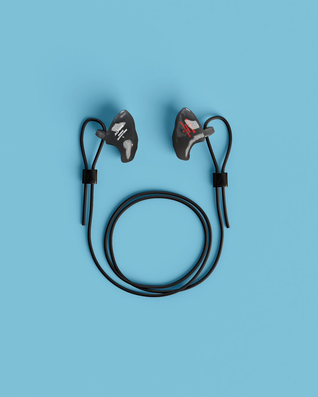 Pair of Alpine WorkSafe Custom Onyx Black earplugs with a coiled black cord, seen from above
