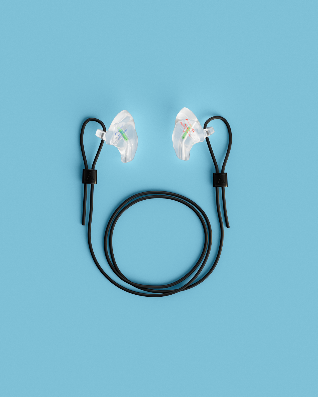 Pair of Alpine WorkSafe Custom Transparent earplugs with a coiled black cord, seen from above