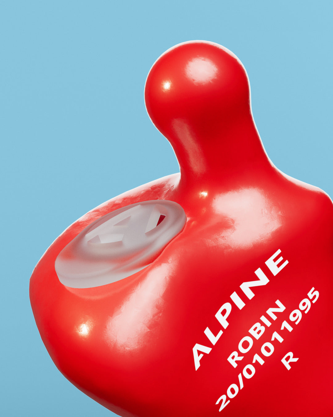 Close-up of an Alpine MusicSafe Custom Red earplug with filter and the engraving &
