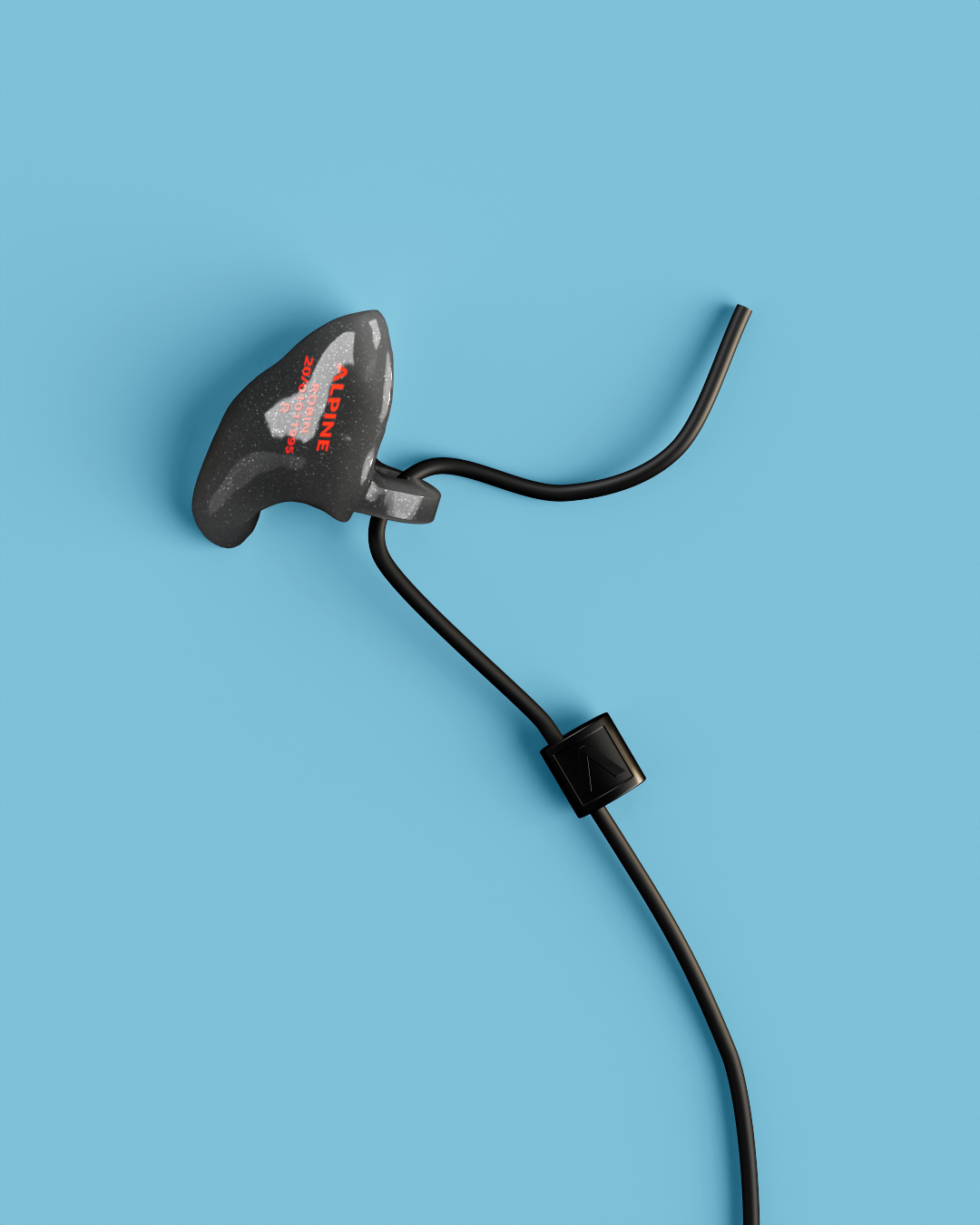 Close-up of a single Alpine WorkSafe Custom Onyx Black earplug attached to a black cord 