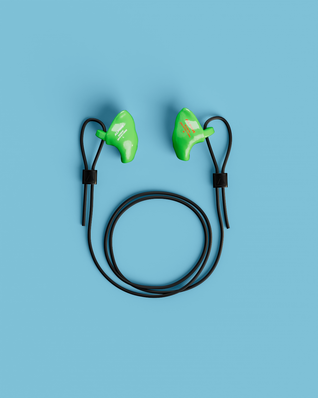 Pair of Alpine WorkSafe Custom Green earplugs with a coiled black cord, seen from above 