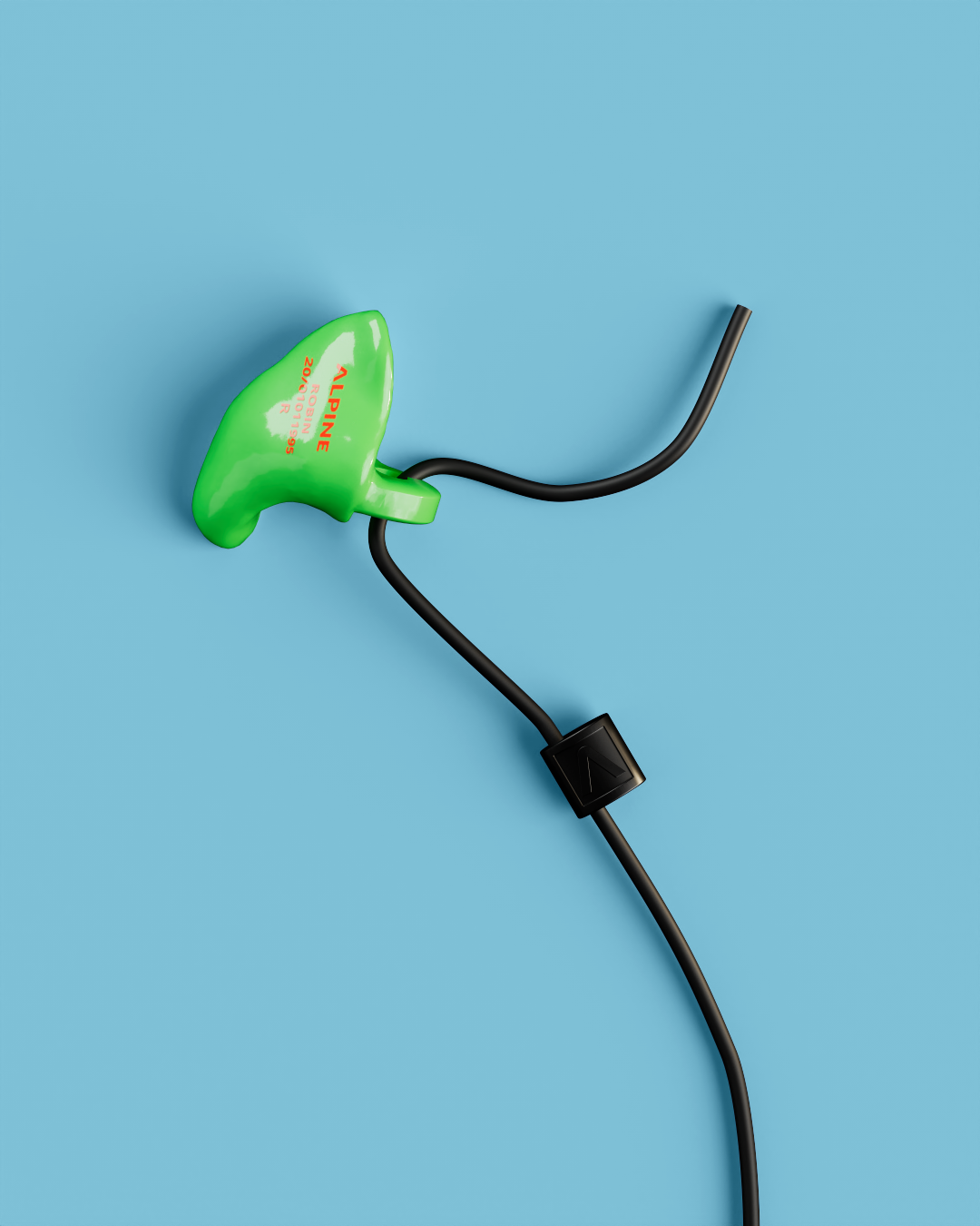 Close-up of a single Alpine WorkSafe Custom Green earplug attached to a black cord 