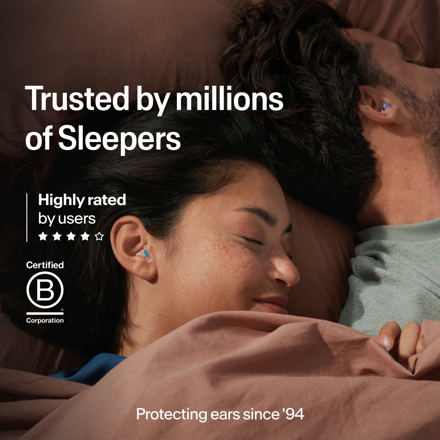 Couple asleep wearing Alpine SleepDeep earplugs in size S, trusted by millions, B Corp certified and protecting ears since 1994 