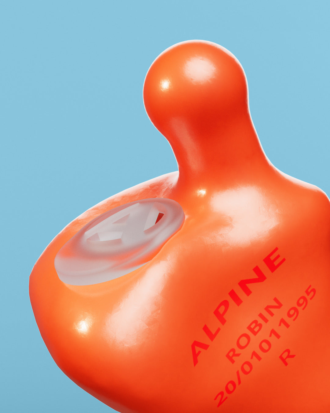 Close-up of an Alpine MusicSafe Custom Orange earplug with filter and the engraving &