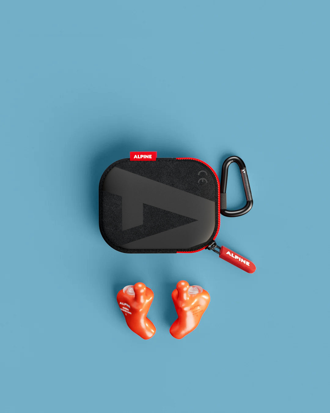 Alpine MusicSafe Custom Orange earplugs with black carrying case, top view 